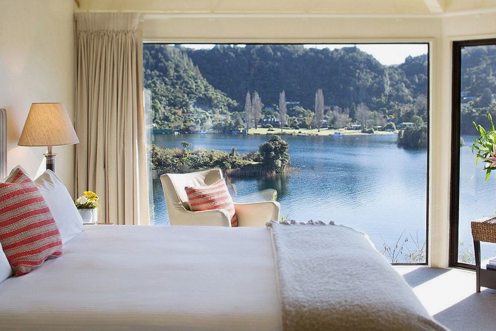 Standard room with queen bed, rimu timber headboard and mountain view
